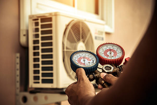 Professional Air Conditioning Service technician working in Kellyton, AL